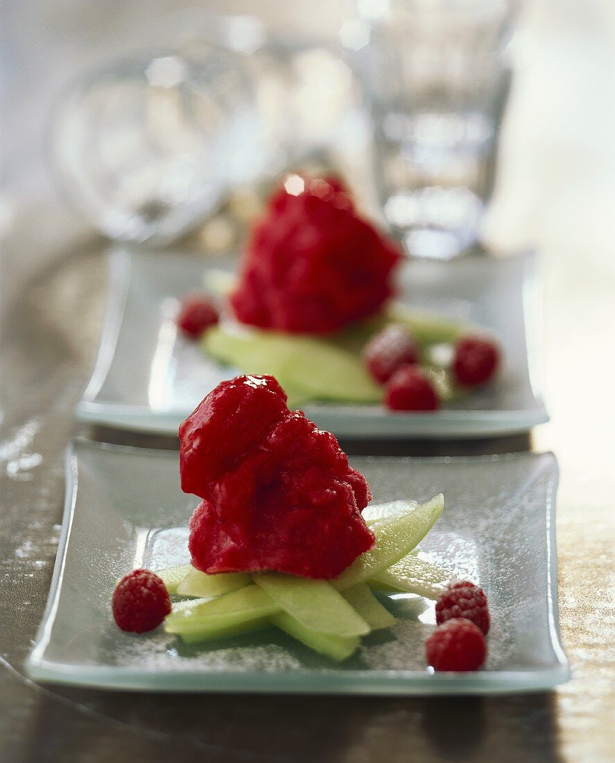 Raspberry ice cream on melon strips