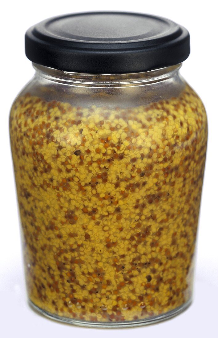 A jar of coarse-grain Dijon mustard