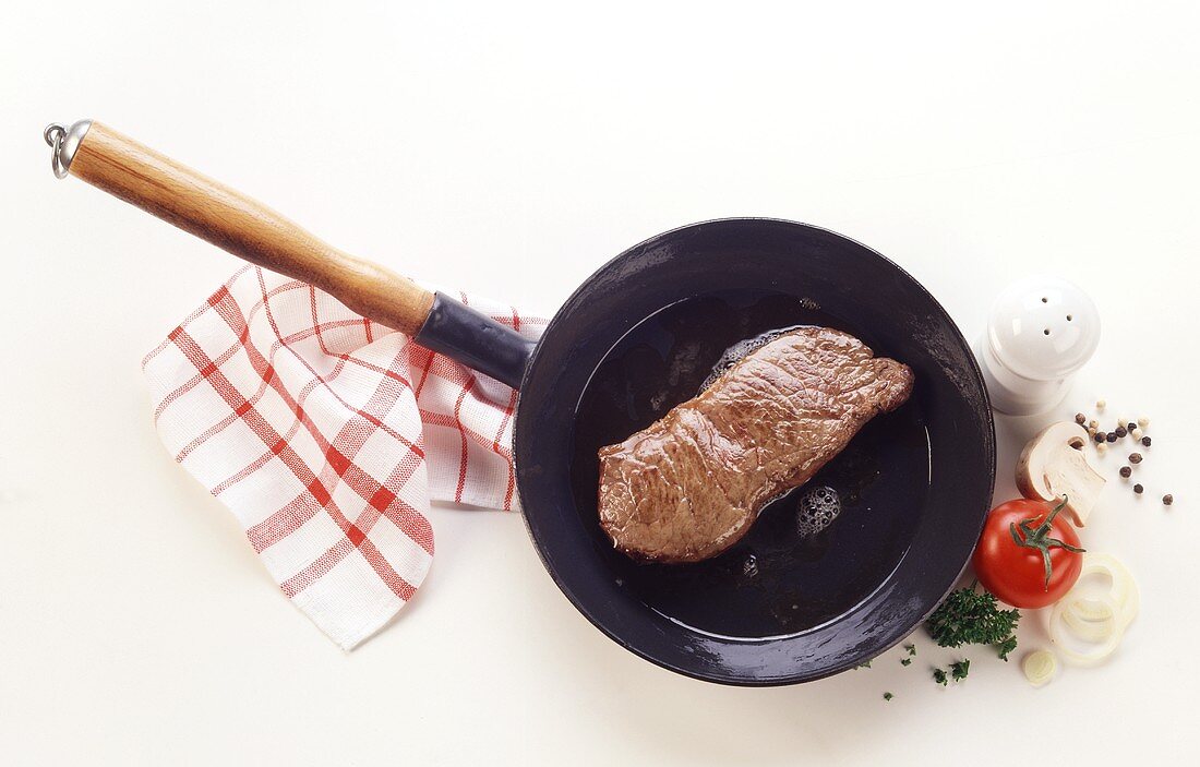 Fried beef steak in the pan