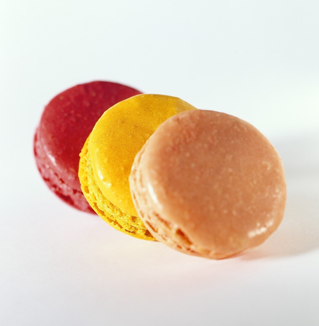 Three macaroons with coloured icing