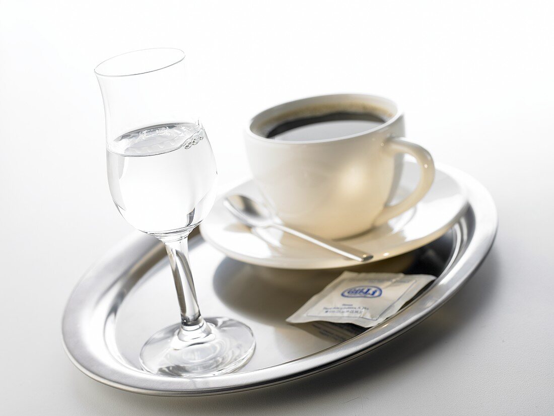 Grappa and coffee cup on tray