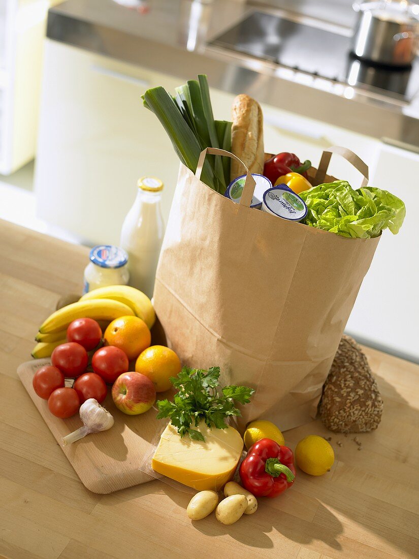 Shopping bag full of groceries in kitchen
