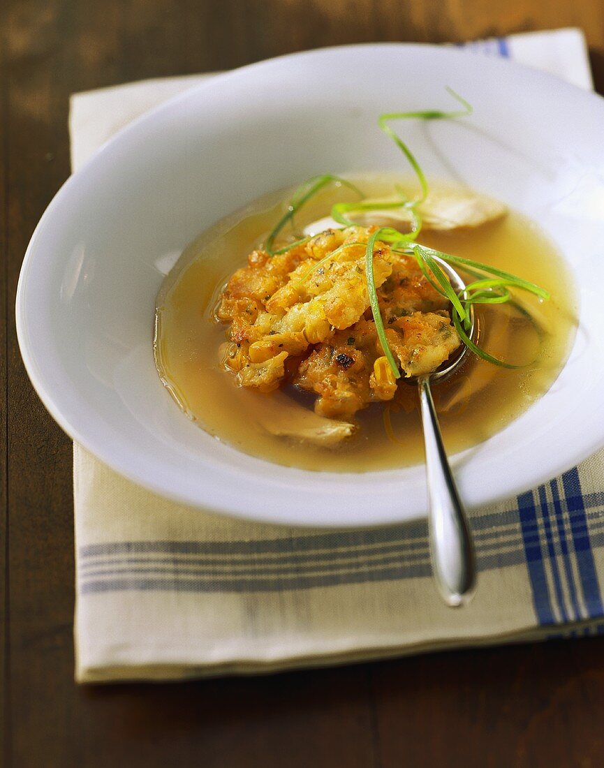 Chicken broth with deep-fried corn cakes