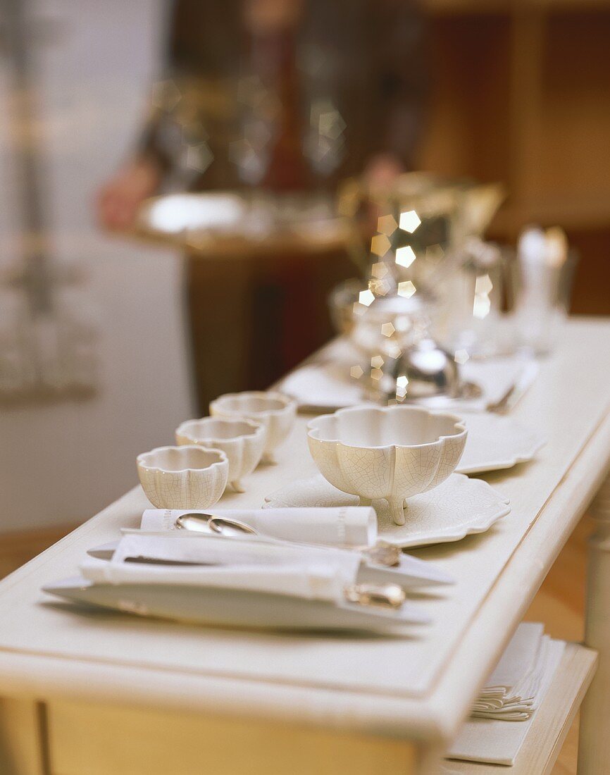 Elegant buffet with white china and silver