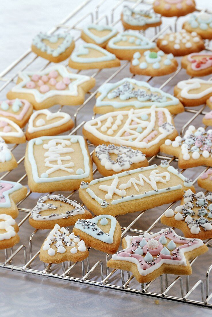 Iced Christmas biscuits on cake rack