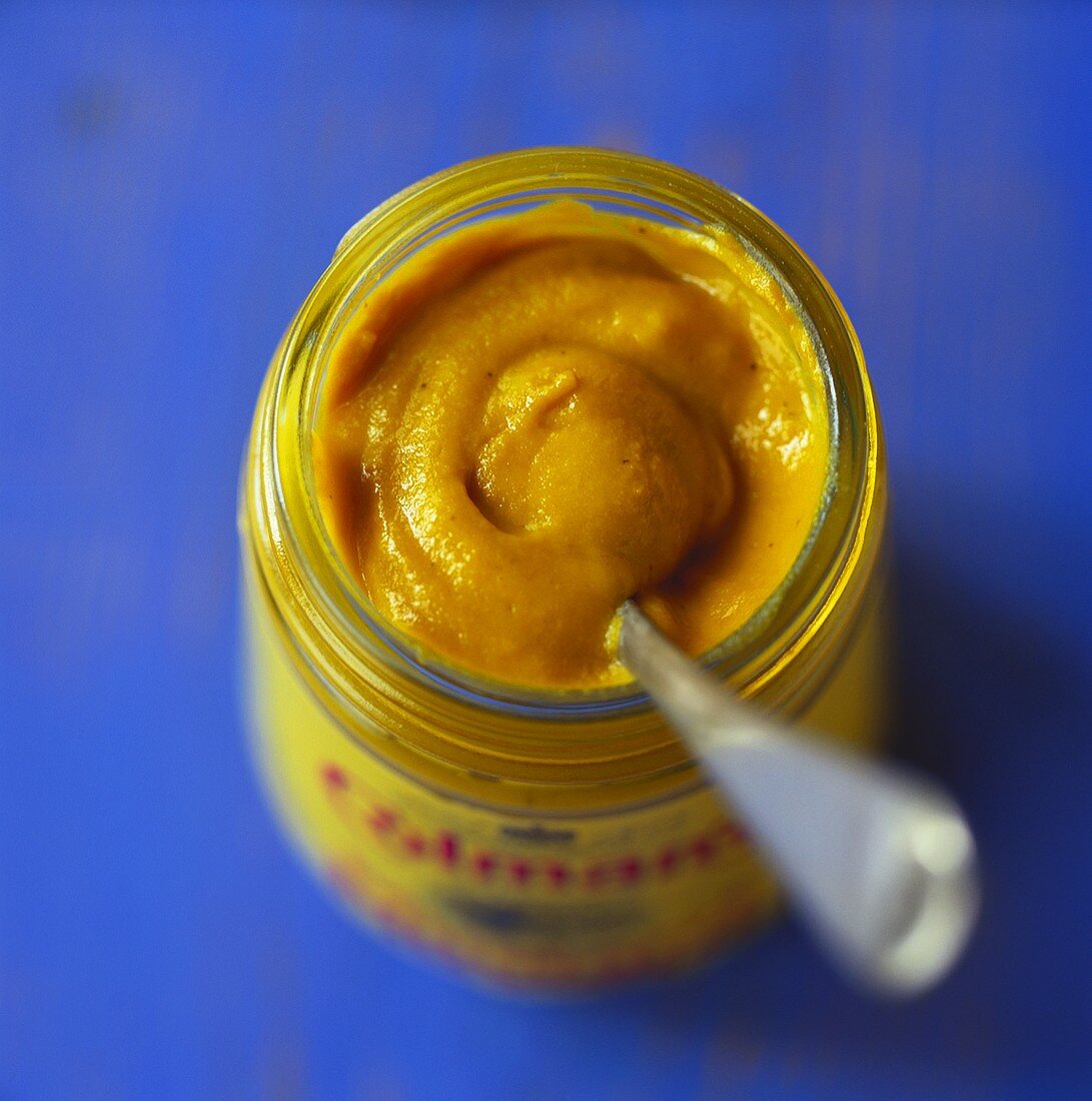 View into a jar of Colman's Mustard (English mustard)