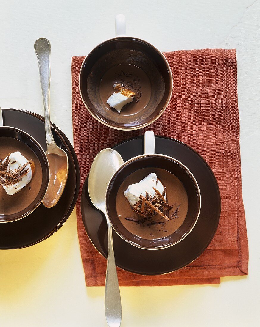 Chocolate soup with chocolate curls and beaten egg white