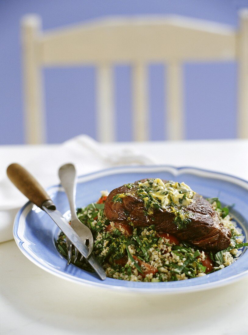 Beef steak with herb butter and tabbouleh