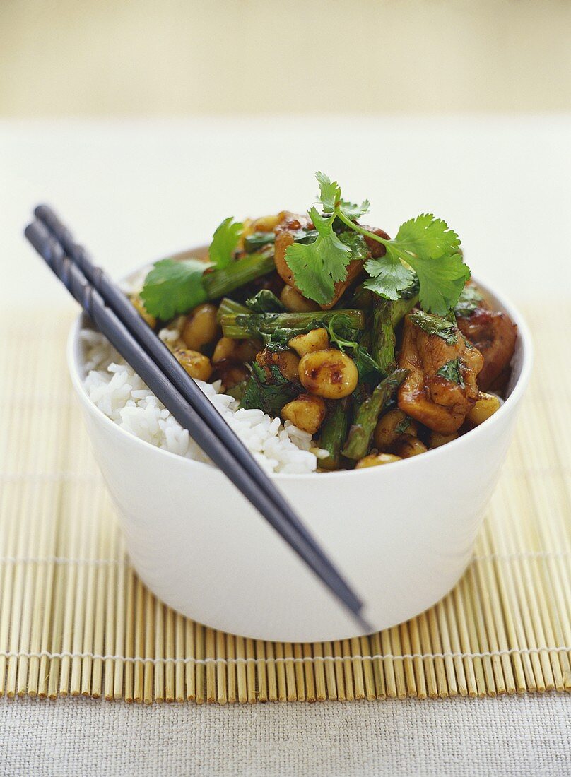 Pork with asparagus, macadamia nuts and rice