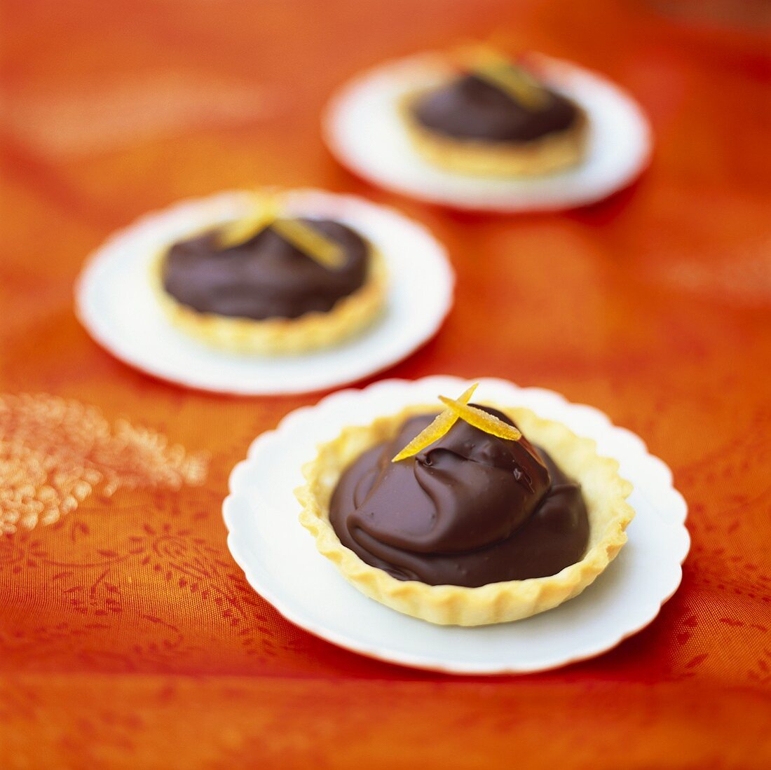 Tartlets with chocolate cream and candied oranges
