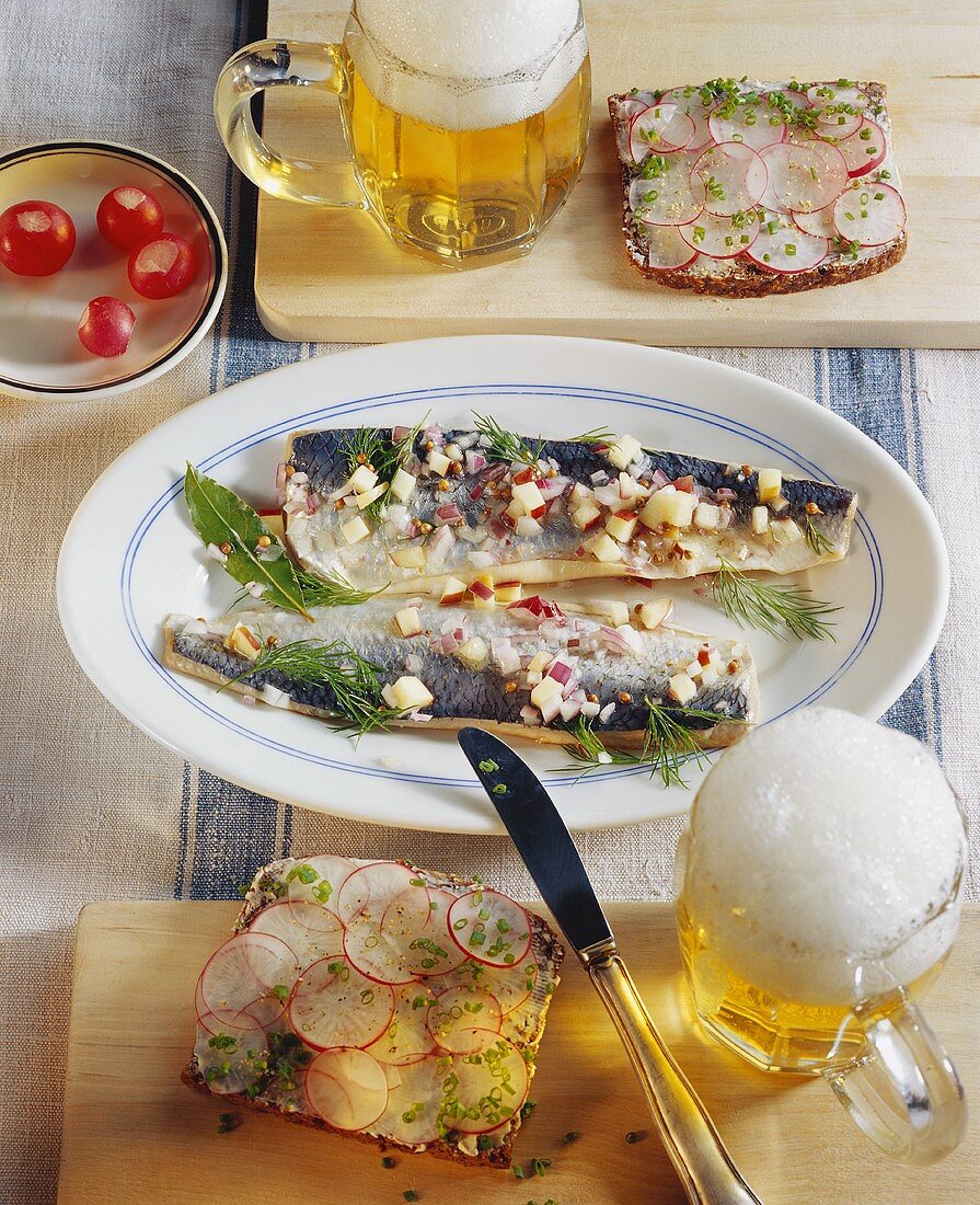 Marinated herrings in cider; radish sandwiches; beer