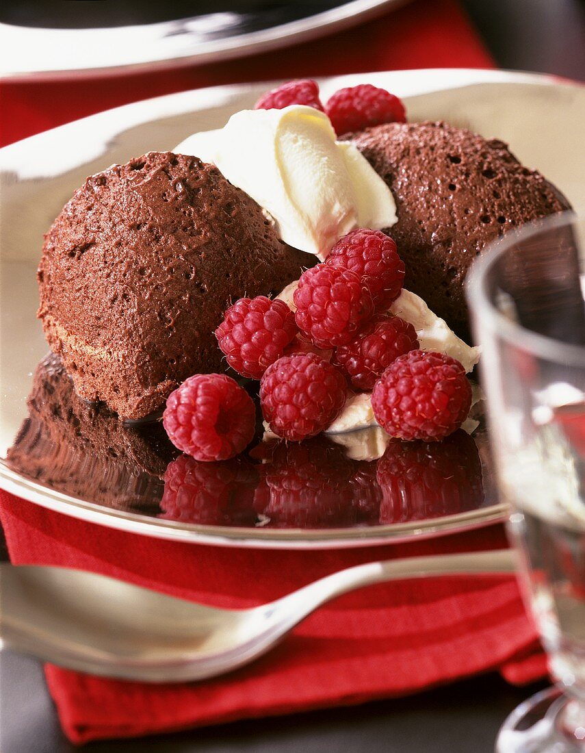 Mousse au chocolat with cream and fresh raspberries