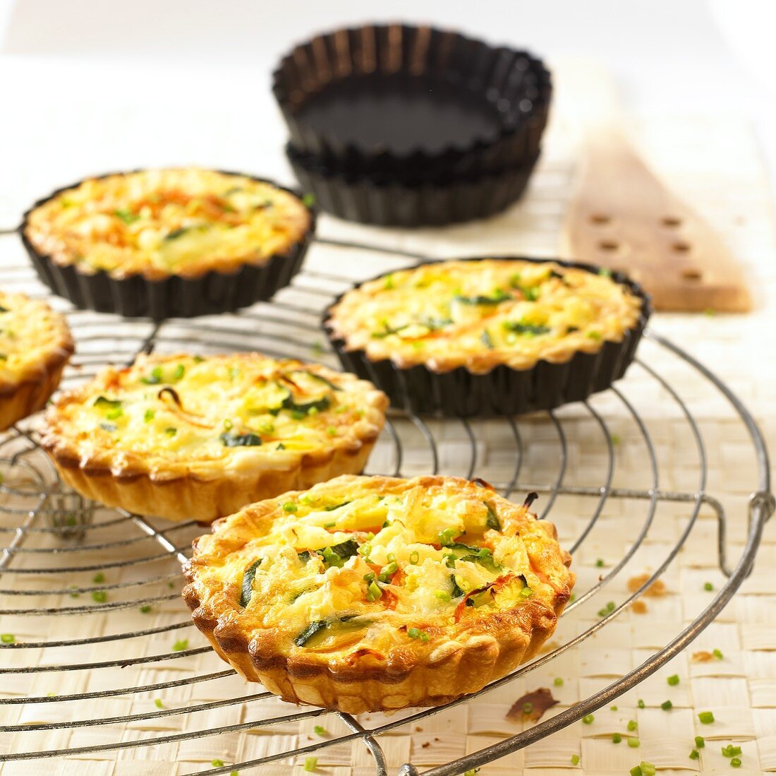 Vegetable tartlets on cake rack