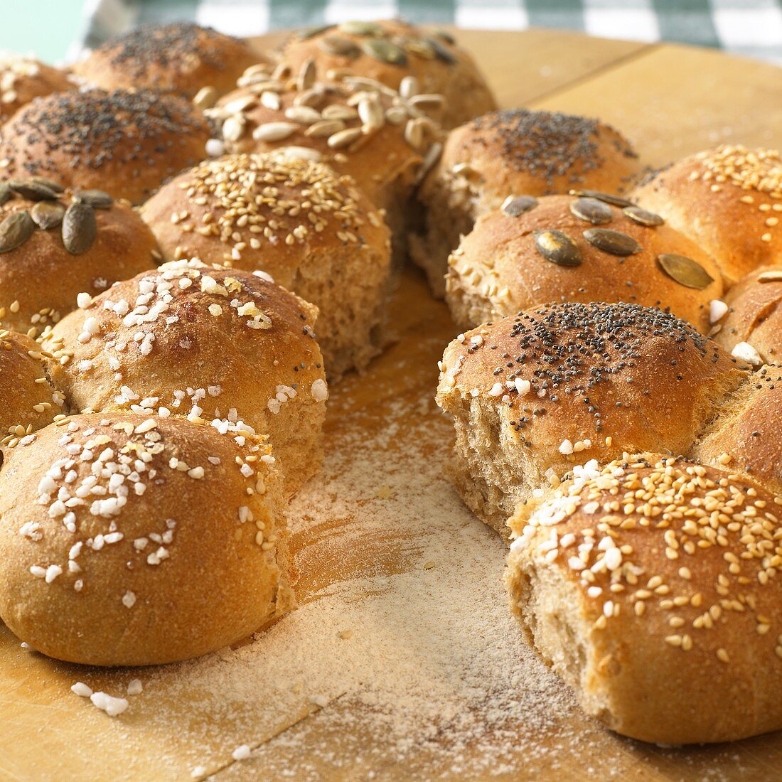 Party rolls with salt, poppy seeds, pumpkin seeds etc.