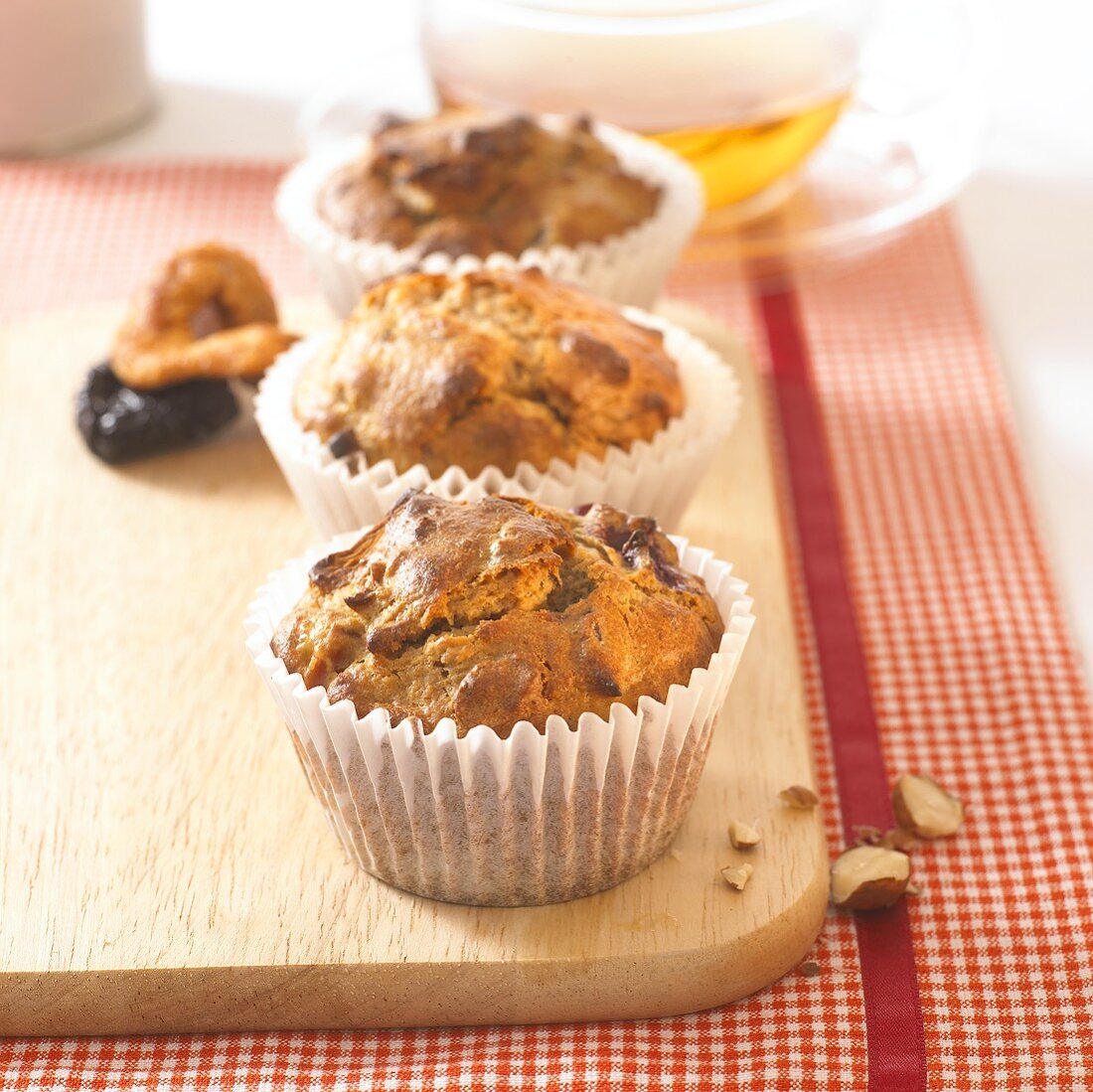 Wholemeal muffins with dried fruit in paper cases