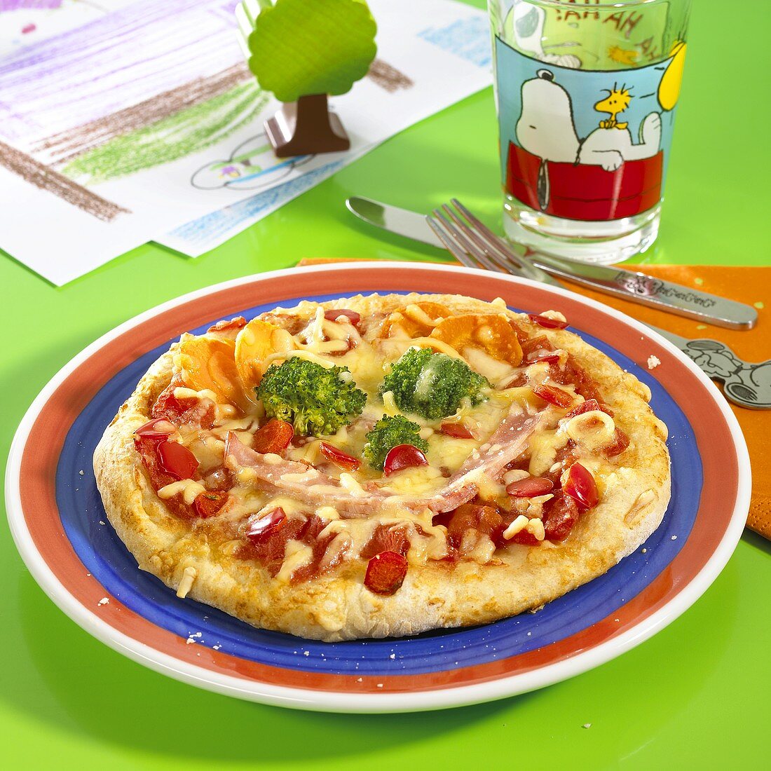 Pizza with ham and vegetables for children