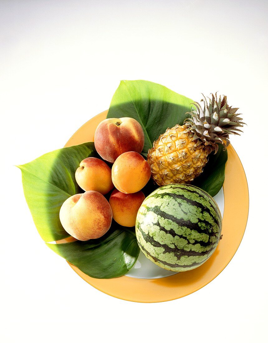 Plate of water melon, pineapple and peaches