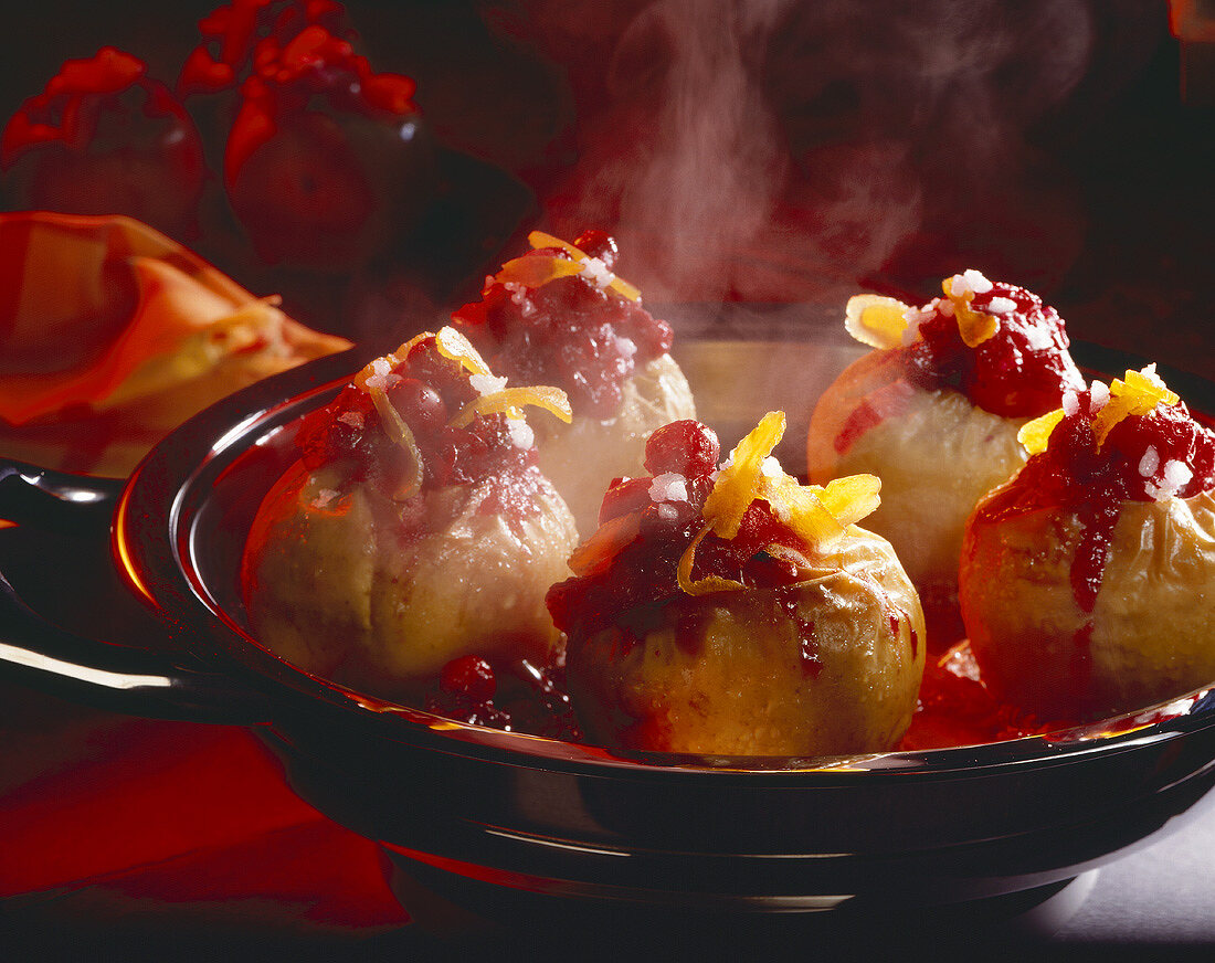 Baked apples stuffed with almond biscuits and cranberries