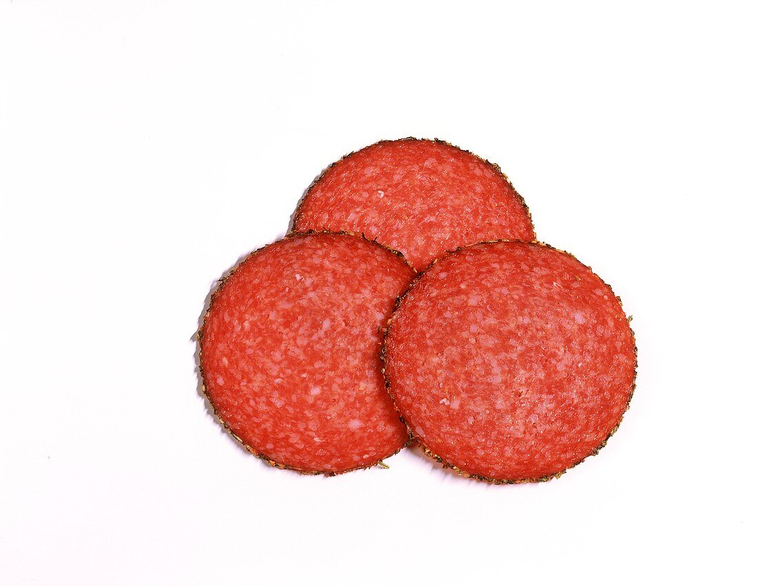 Three slices of pepper salami