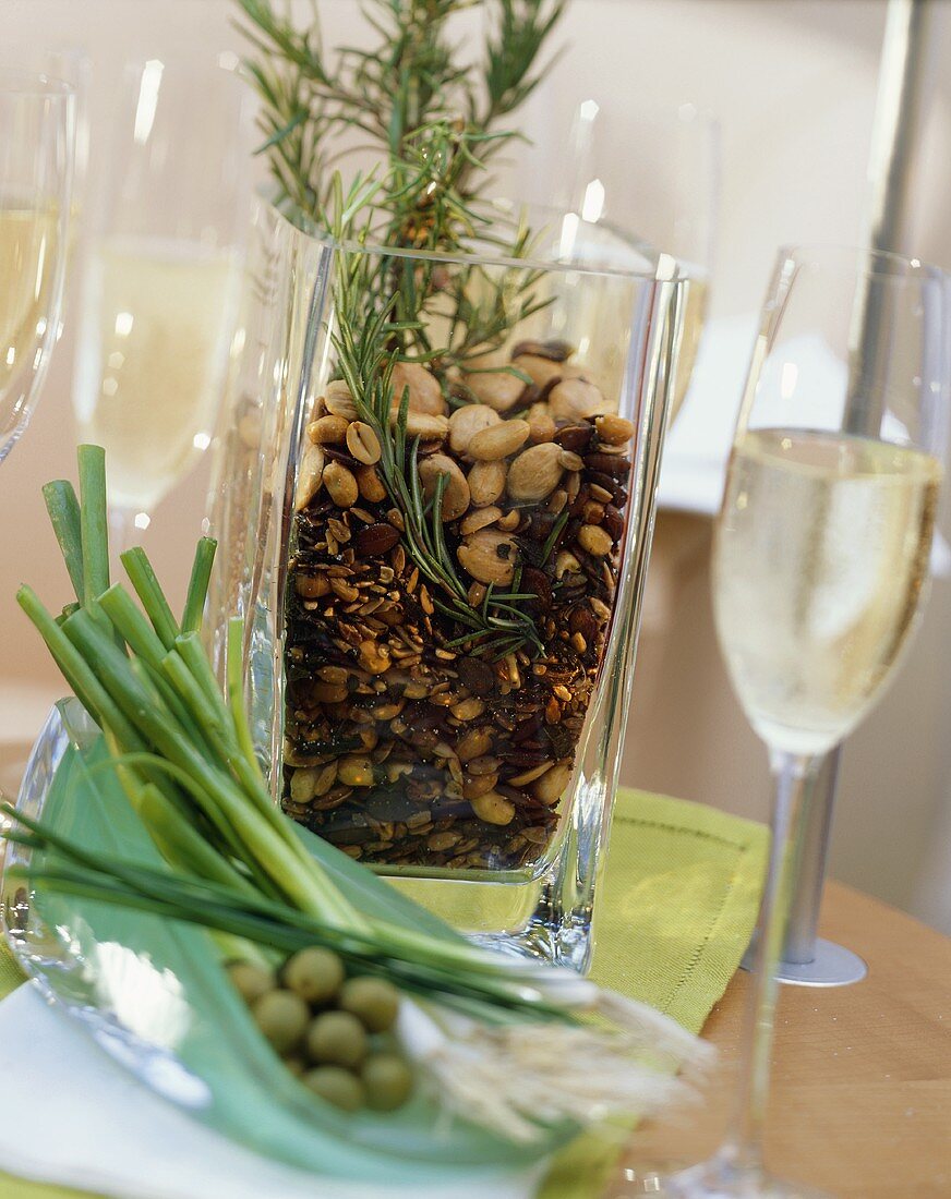 Roasted nuts with herbs in a glass