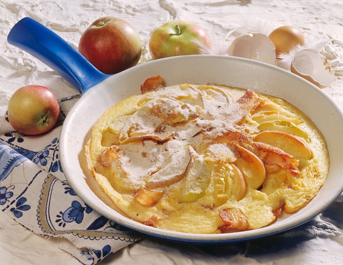 Omelette with apple slices and bacon