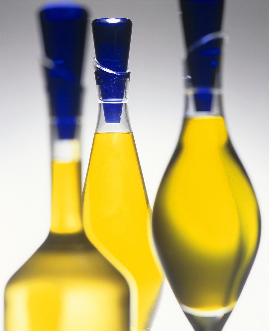 Olive oil in three decorative bottles