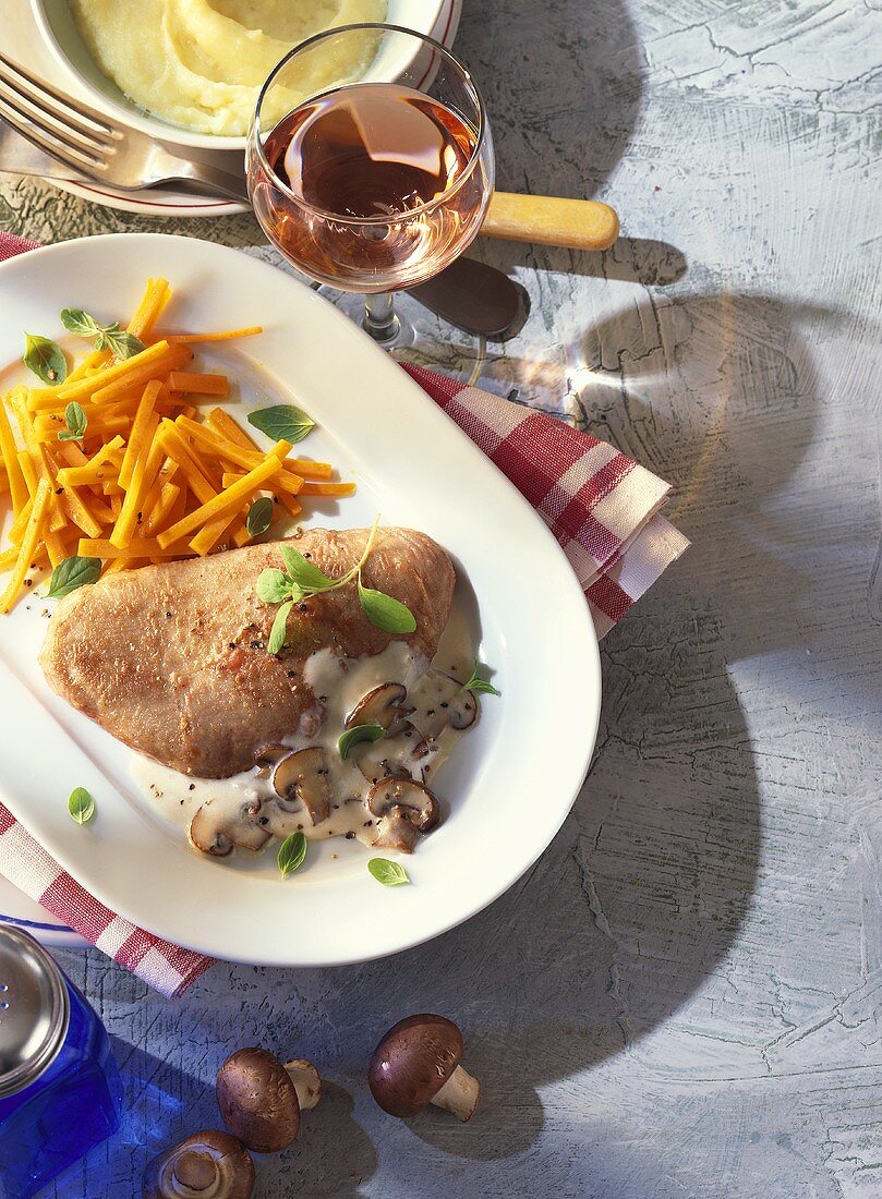 Turkey steak with creamed mushrooms and carrots