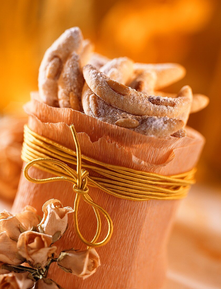 Pine nut cookies in a paper bag