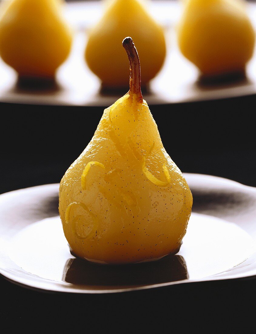 Poached pear with lemon zest