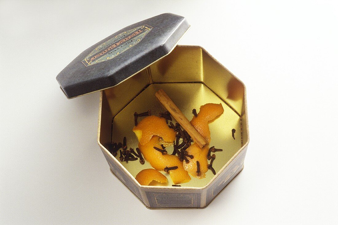 Cloves, cinnamon, orange peel in a biscuit tin