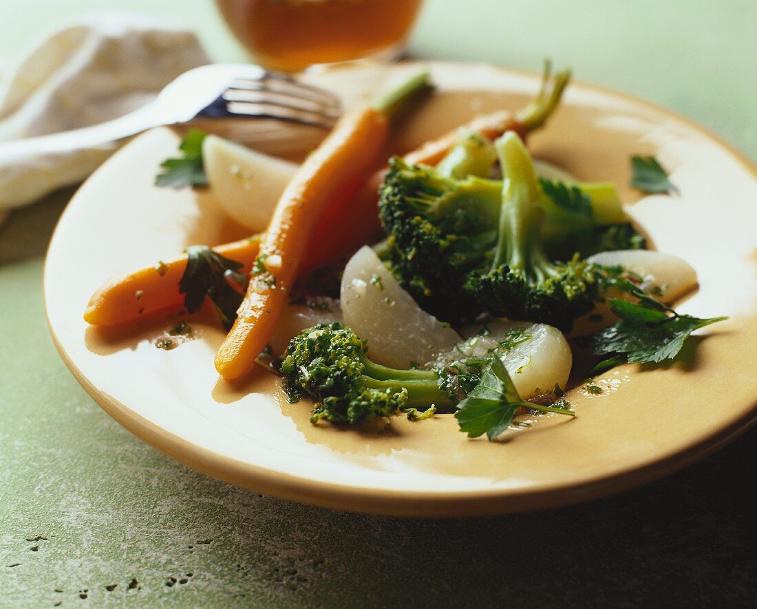 Steamed vegetables with herbs and oil and vinegar sauce