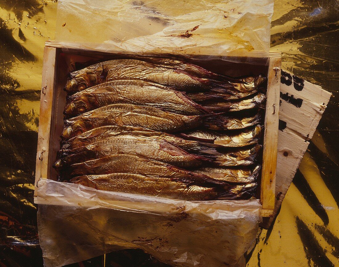 Several Kiel sprats in a wooden box