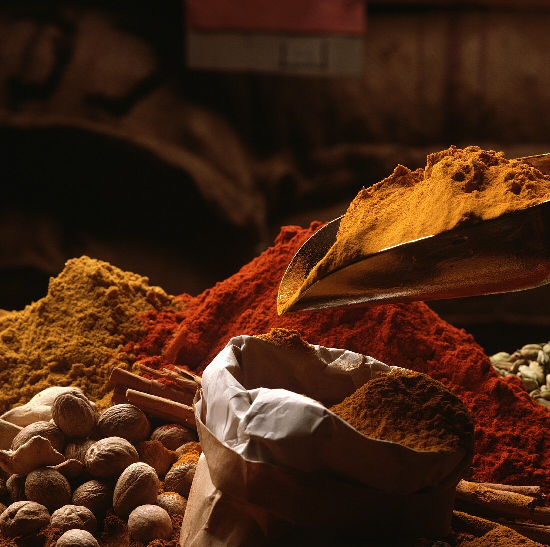 Various spices in a sack and on a scoop
