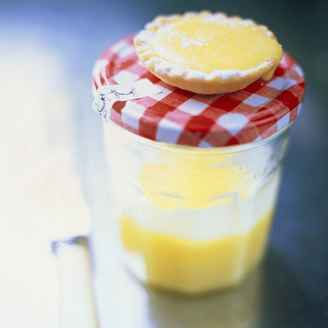Lemon tartlet on a preserving jar