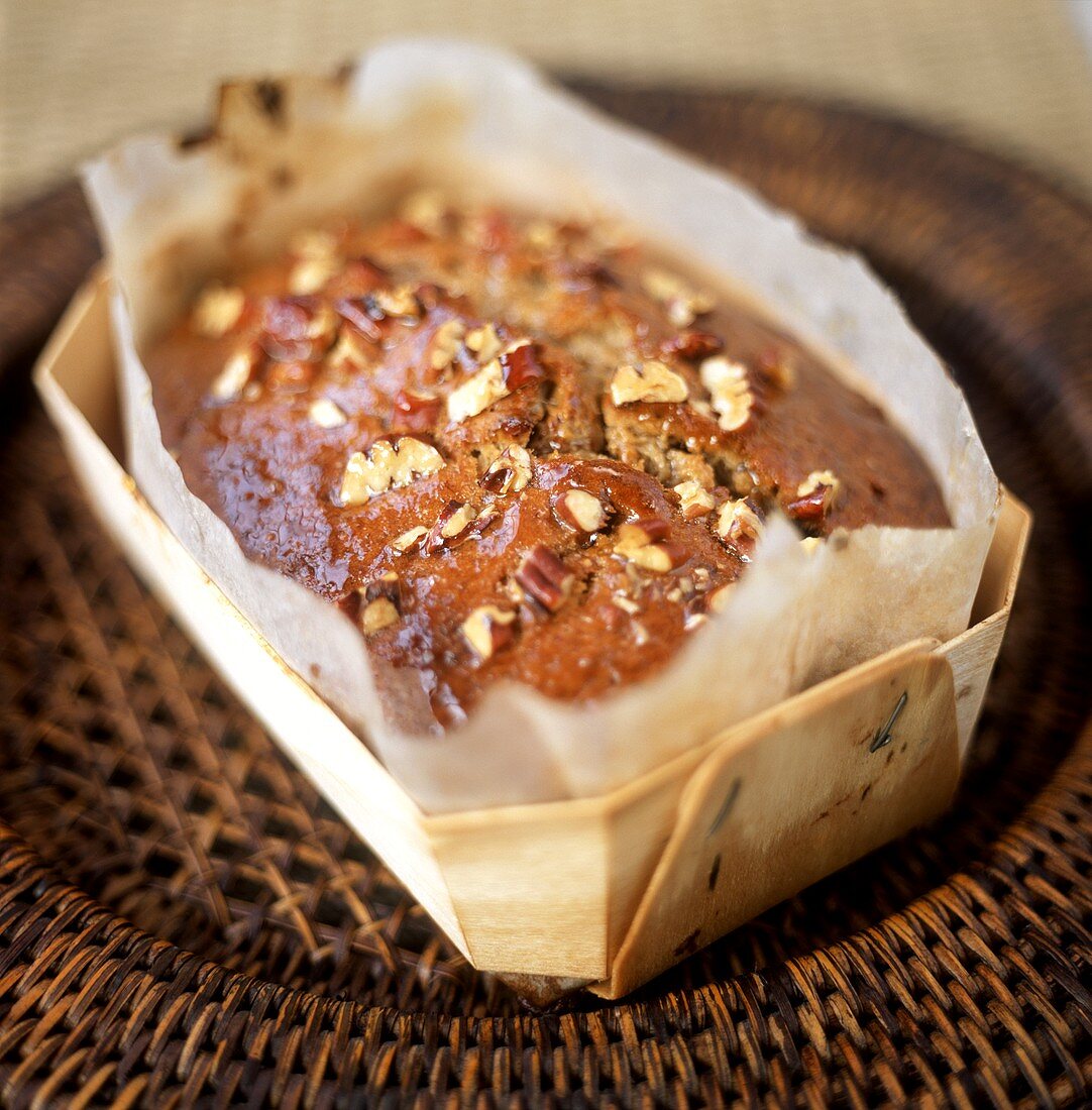 Pecan nut cake in a wooden dish