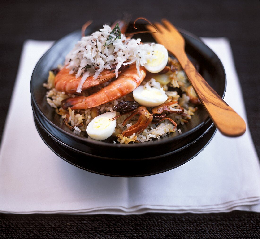 Fried rice with seafood, eggs and grated coconut