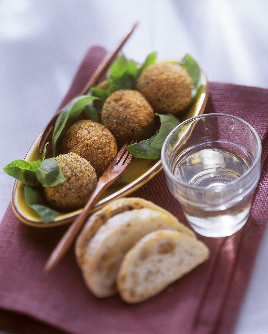 Deep-fried fish balls on basil