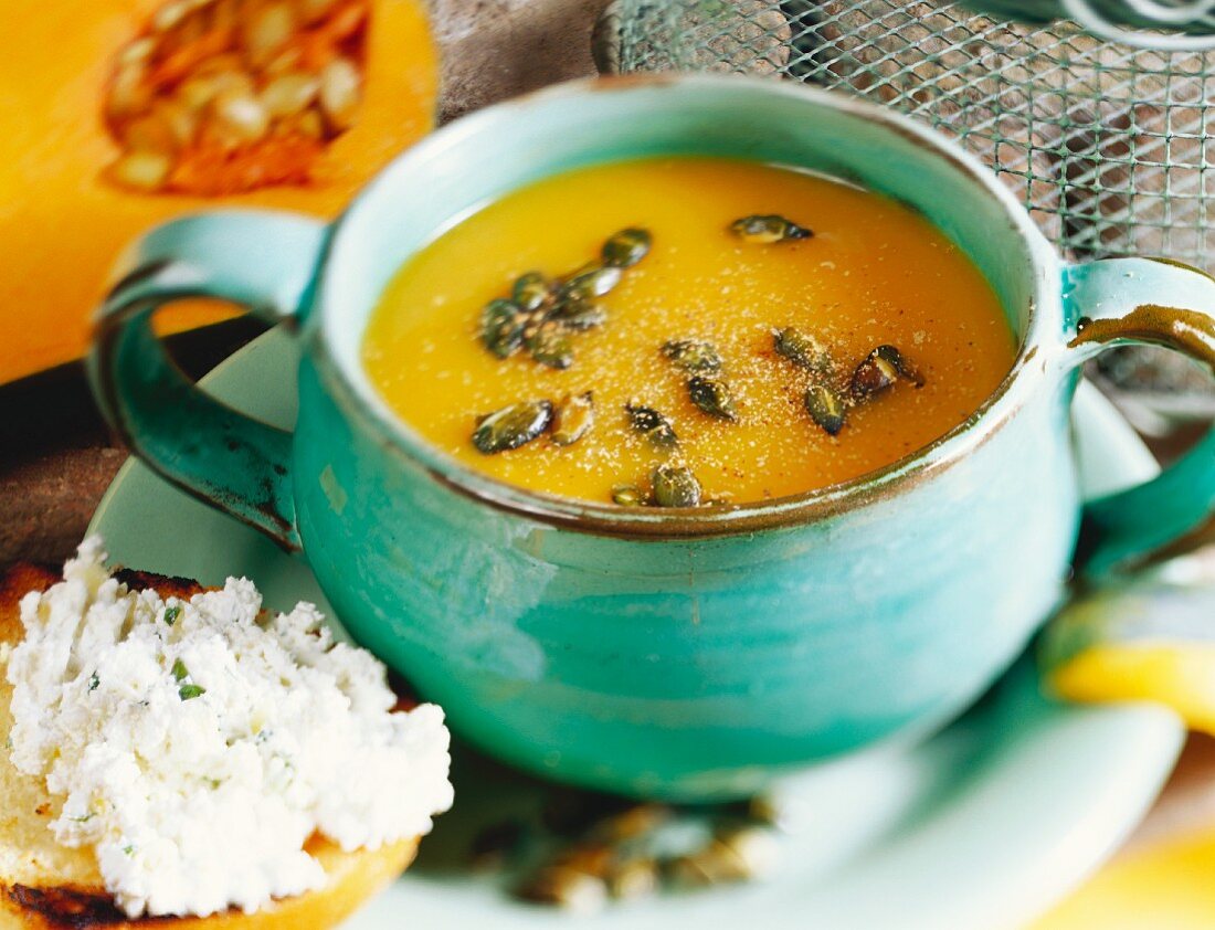 Cold cream of pumpkin soup, with toast and herb quark