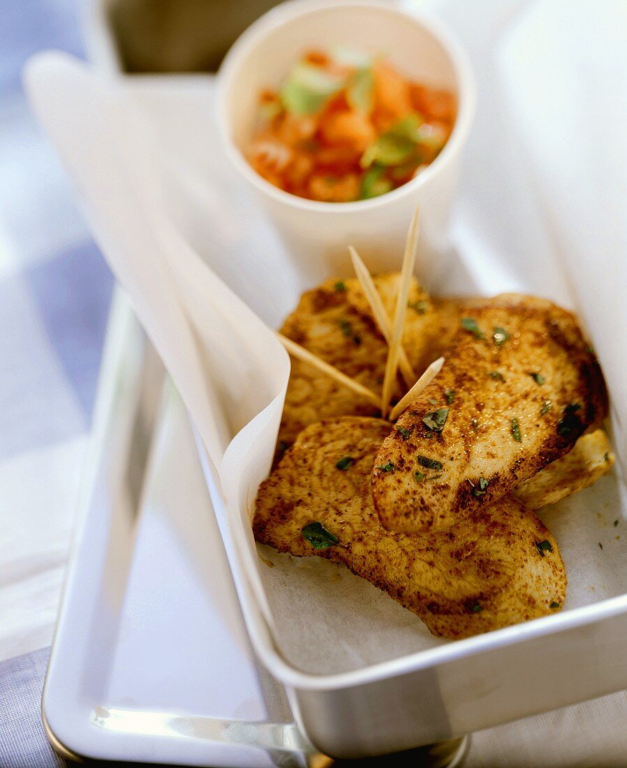 Fried turkey breast fillets with tomato salsa in lunchbox