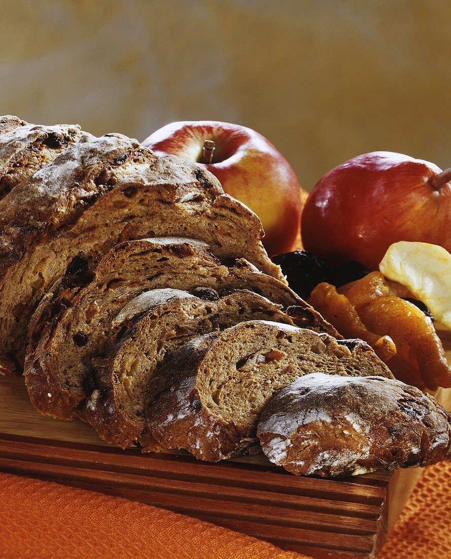 Fruit bread, a slice cut; apple, pear and dried fruit