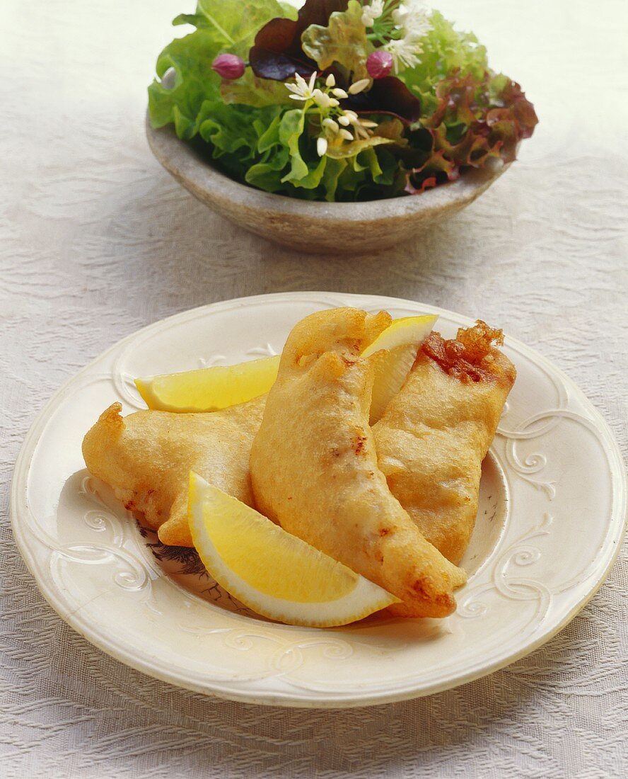 Fish fillets in beer batter with mixed salad (Switzerland)