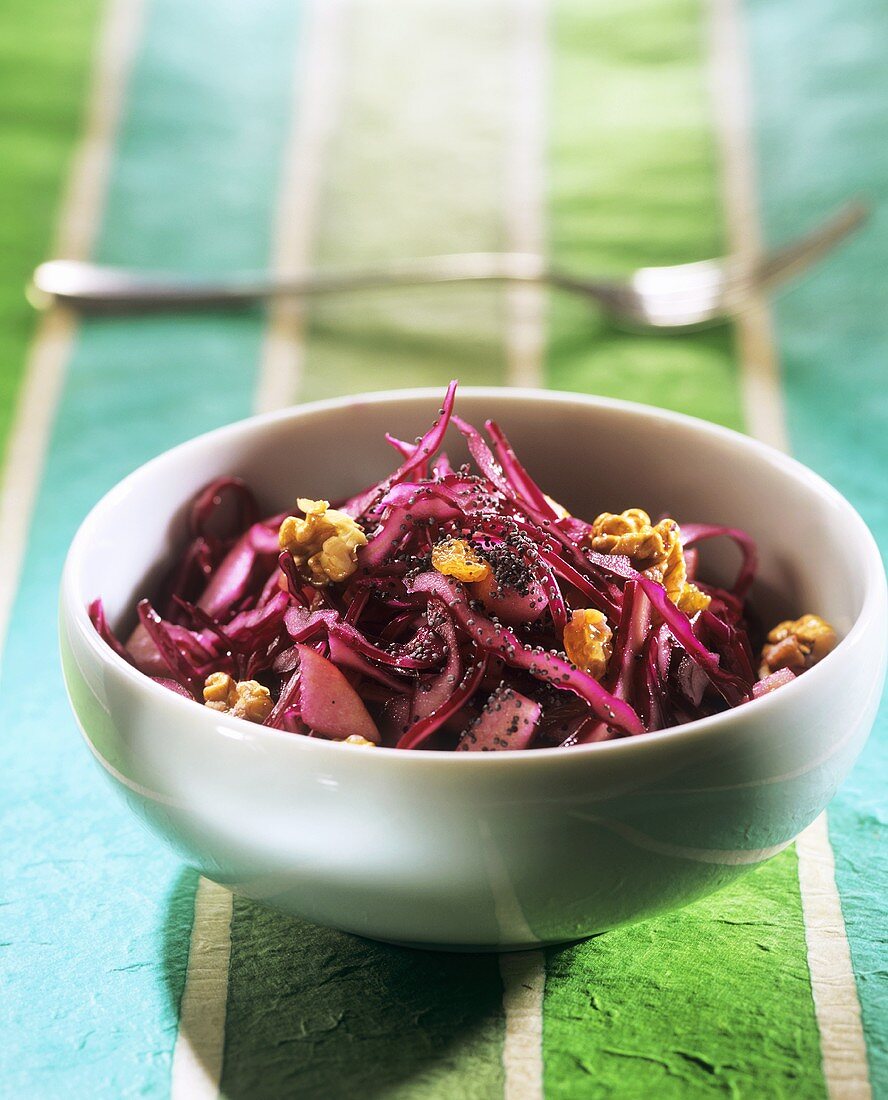 Red cabbage salad with raisins, poppy seeds and walnuts