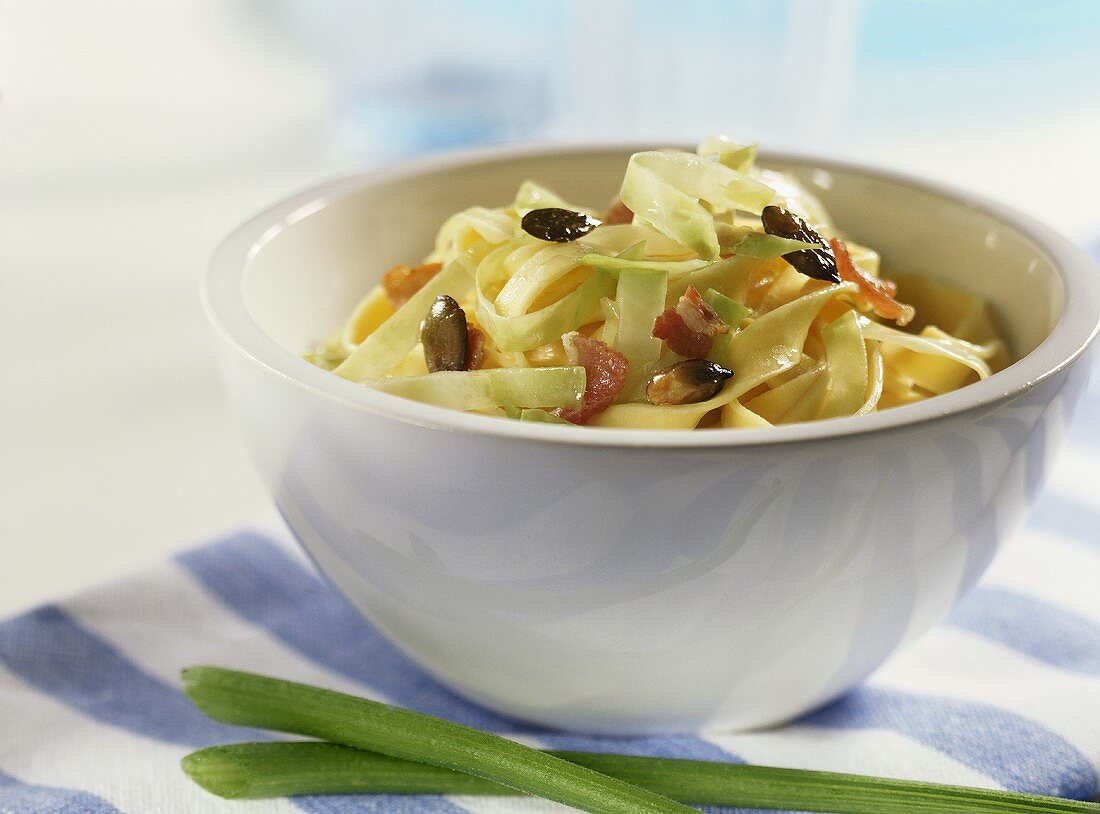 Krautfleckerl (pasta with cabbage) with bacon & pumpkin seeds