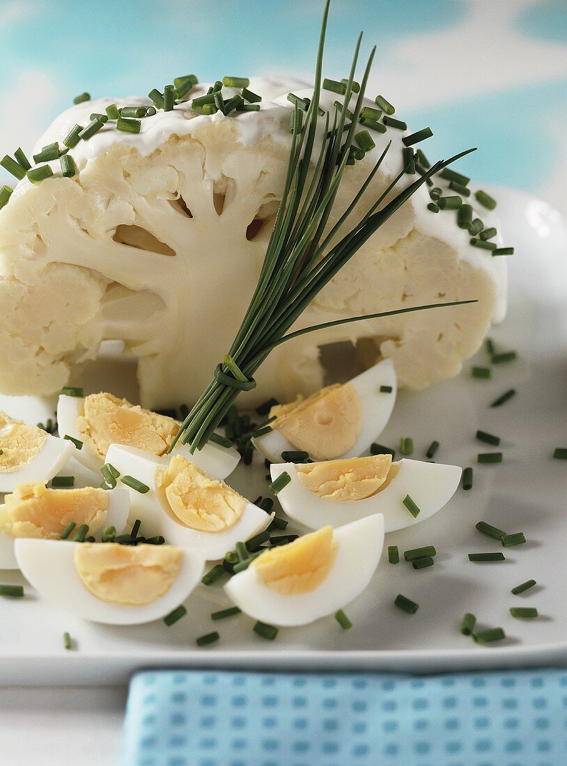 Cauliflower with sour cream, chives and boiled eggs