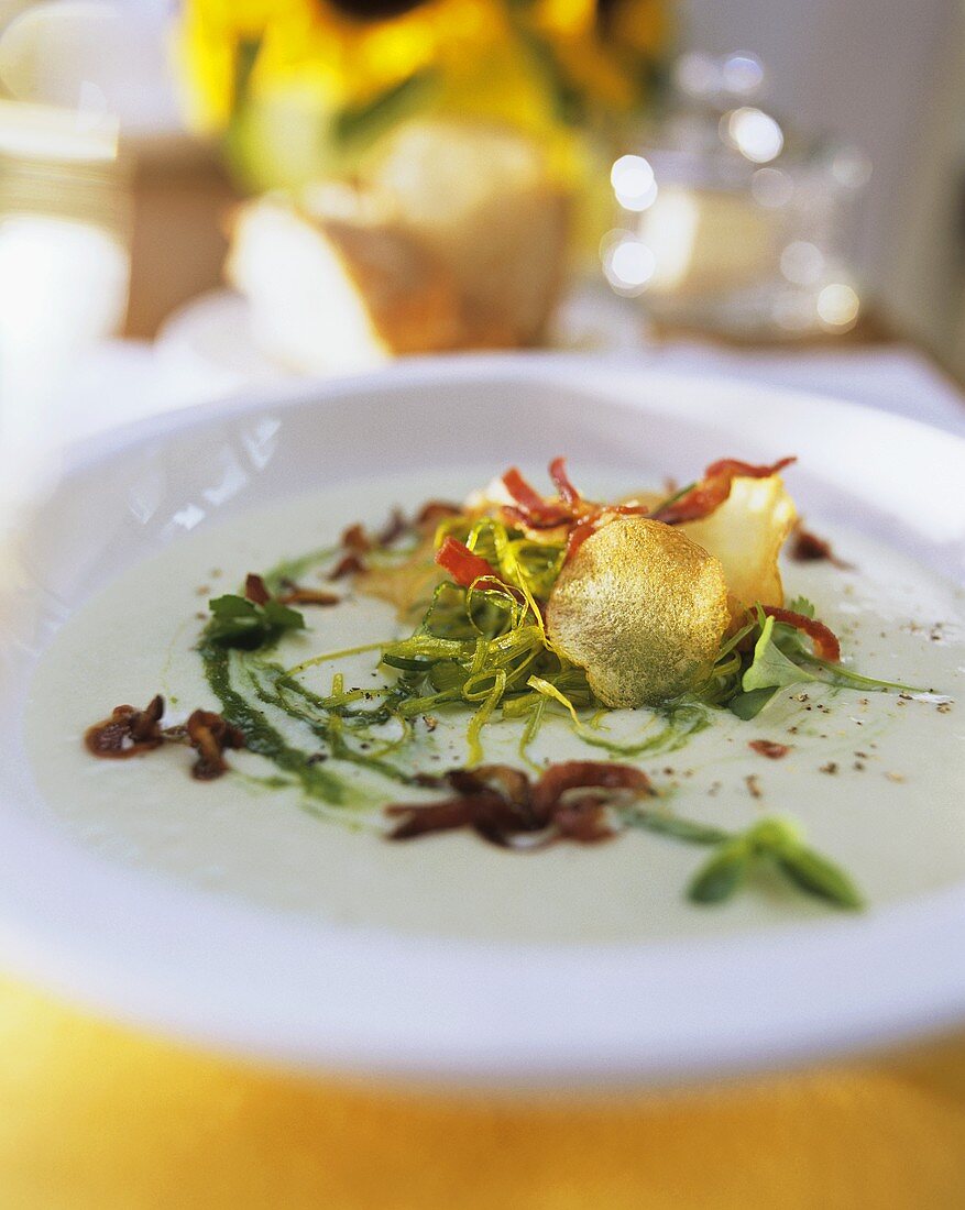 Leek and potato soup with bacon and herbs