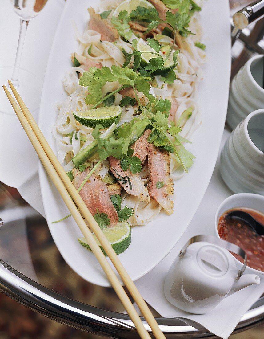 Rice noodle salad with duck breast and limes for brunch