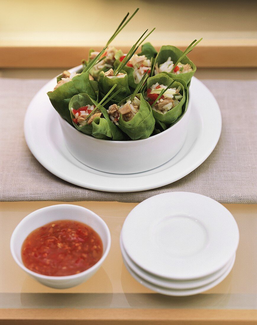 Filled lettuce rolls with chili sauce for fitness brunch