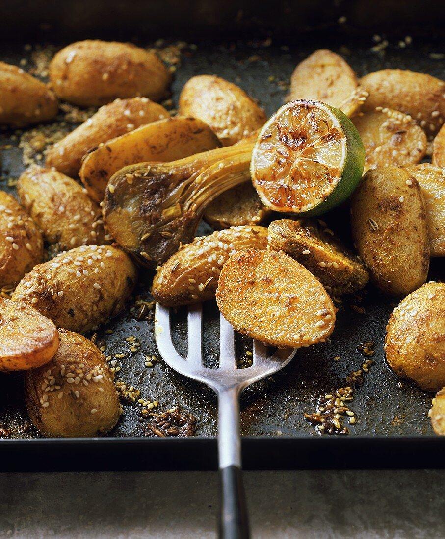 Roast potatoes with sesame, cumin and garlic