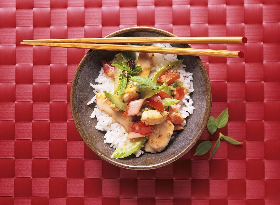 Chicken curry with peppers and celery on rice