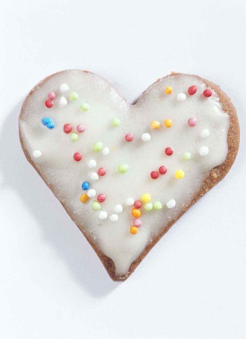 Heart-shaped biscuits with glace icing and 100s and 1000s